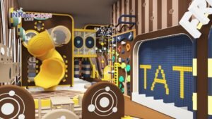 Indoor kids playground with yellow slides and climbing wall